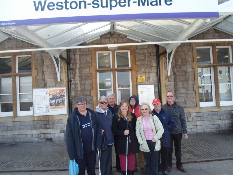 Ernest, Harry, Spud, Julie, James, Sylvia, Andrew &amp; Paul outside Weston railway station 09.40 hrs